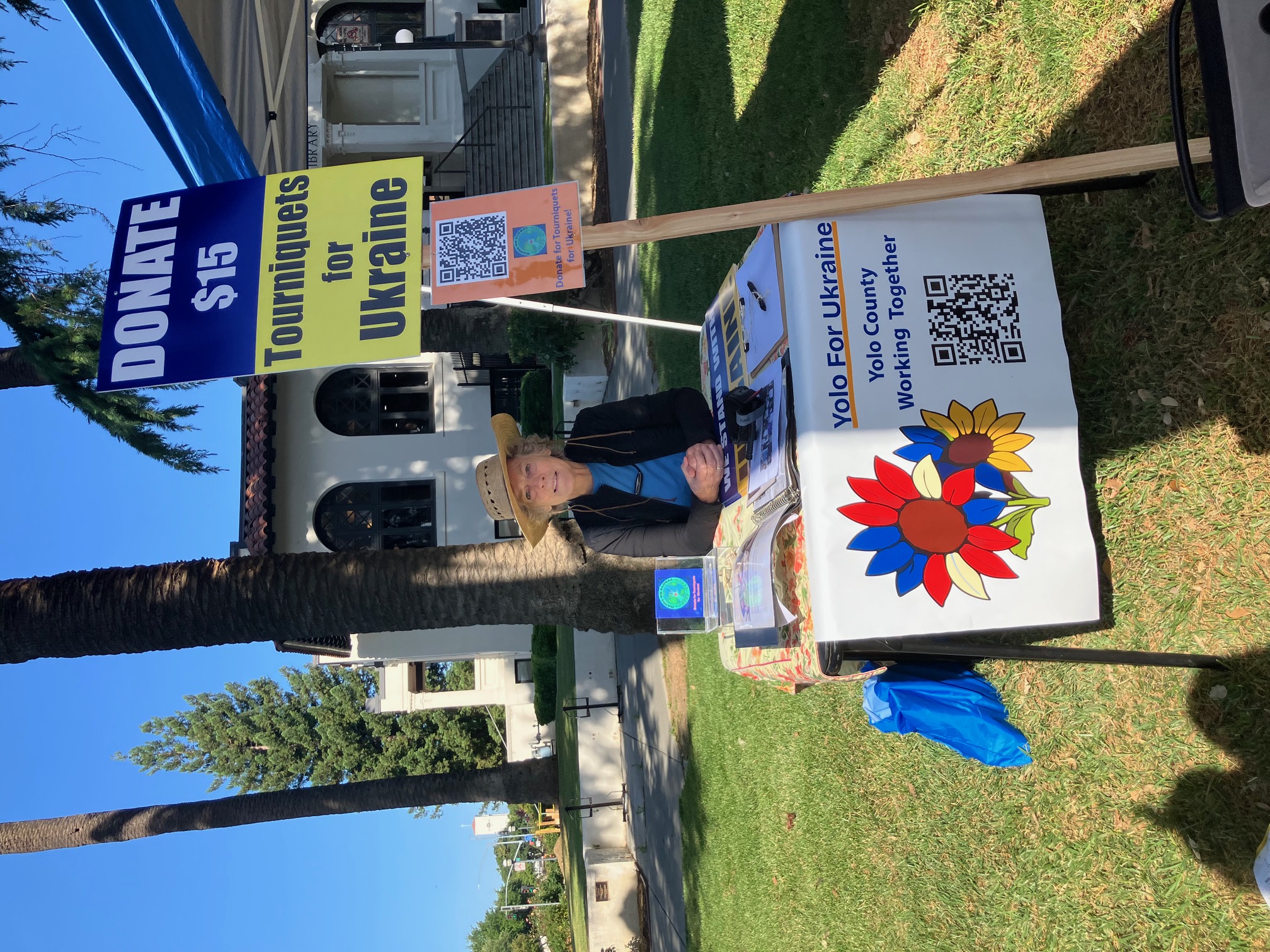 Nancy Fischer, co-founder of Yolo For Ukraine, collecting donations for tourniquets in front of Woodland Public Library