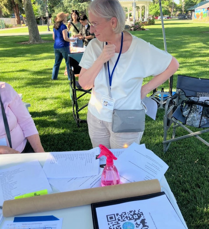 Peggy Bernardy helping us run our table at May Day Rally