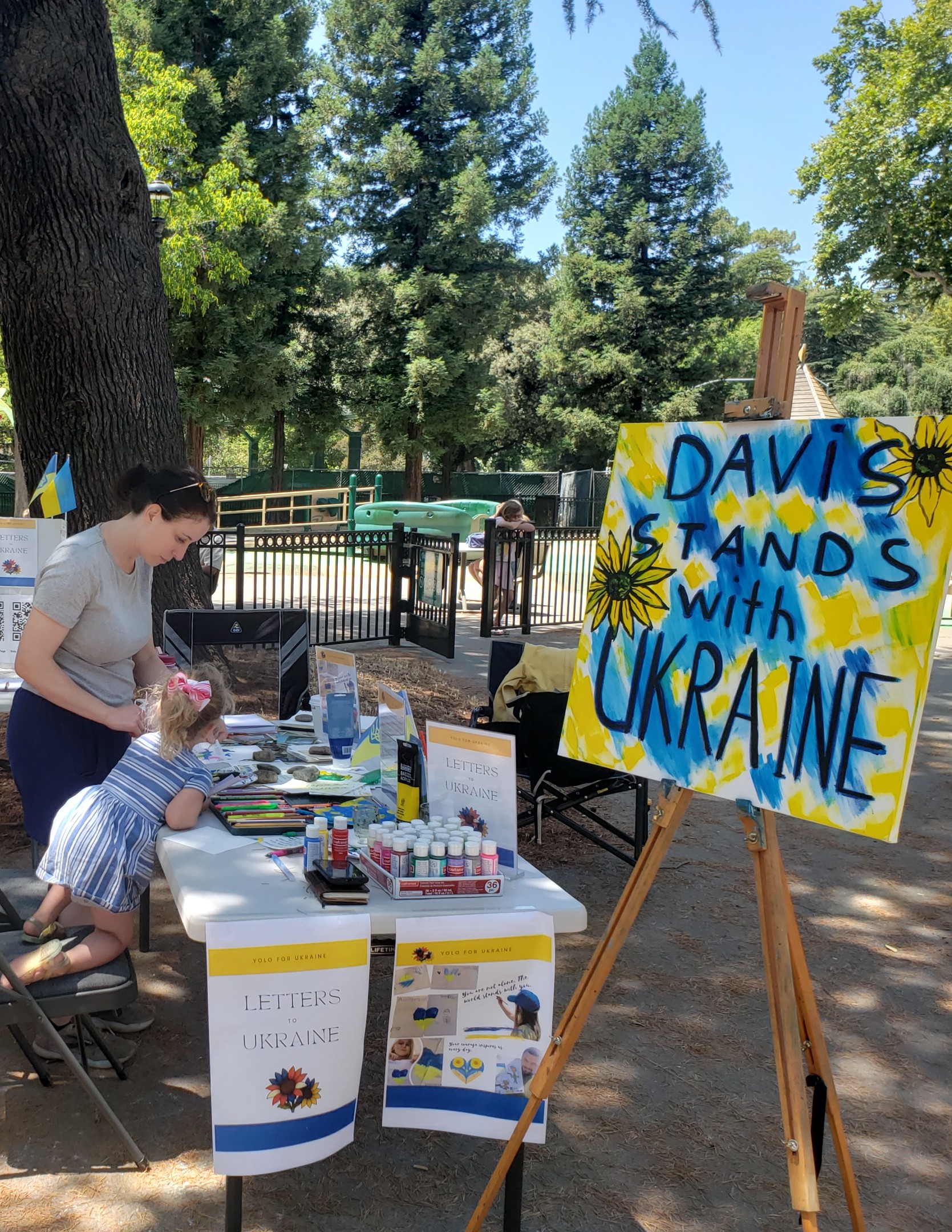 Yolo For Ukraine together with The Sunflower Society at the Davis Farmers Market joined by kids and parents to write letters to Ukrainian front line soldiers.